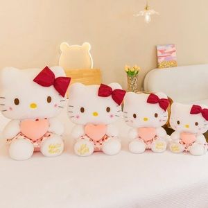 Hello Kitty plushie doll with a heart dress, different sizes, new condition.